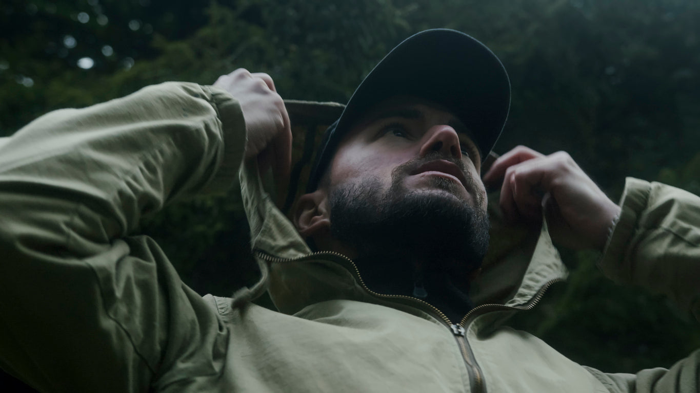 A man in a forest preparing for an emergency